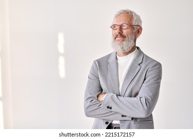 Smiling mature older successful gray-haired business man leader, thoughtful middle aged senior professional businessman crossed arms looking away thinking standing isolated on white wall, portrait. - Powered by Shutterstock