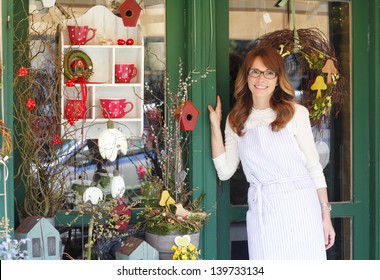 Smiling Mature Woman Florist Small Business Flower Shop Owner. Shallow Focus.