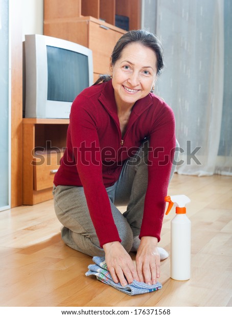 Smiling Mature Woman Rubing Floor Furniture Stock Photo Edit Now