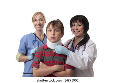 Smiling Medical Doctor And Nurse And Child Fitted With A Cervical Collar.