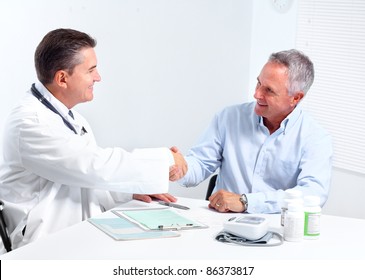 Smiling Medical Doctor With Senior Man. Health Care.