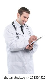 Smiling medical doctor writing notes on the clipboard. Isolated on white background