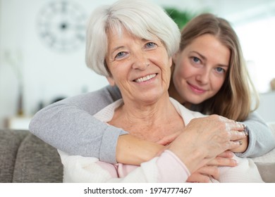 smiling middle aged mature woman with her daughter
