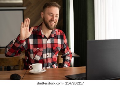 Smiling Millennial Caucasian Casual Man, Smiling While Working With Apps, Guy Chatting Online On Laptop, Sitting At Table In Cafe, Happy 30 Year Old Businessman Using Wi-fi In Public Place In Cafe