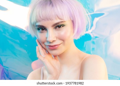 Smiling Modern Young Blond Girl With Shiny Glowing Perfect Facial Skin. Cosmetology, Dermatology And Skincare Concept. Cool Teen Fashion Model With Violet Hair.