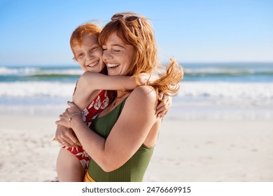 Smiling mom and beautiful girl both with red hair and freckles having fun at the beach during summer vacation. Portrait of happy curvy woman holding cute little girl in swimsuit at seaside, copy space - Powered by Shutterstock