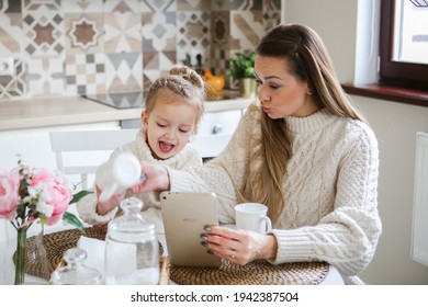 Smiling Mother Takes Selfie With Cute Daughter On Tablet, Happy Young Mom Laughing Makes Photo With Daughter At Home, Single Mom And Adopted Children Playing Fun With Phone