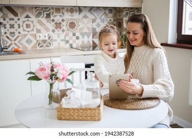 Smiling Mother Takes Selfie With Cute Daughter On Tablet, Happy Young Mom Laughing Makes Photo With Daughter At Home, Single Mom And Adopted Children Playing Fun With Phone