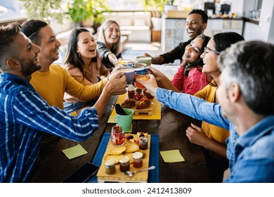 Smiling multiracial group of young people having breakfast together at coffee eatery shop - Powered by Shutterstock