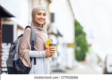 Smiling Muslim Girl Student Drinking Coffee On Street Before Studying, Copy Space