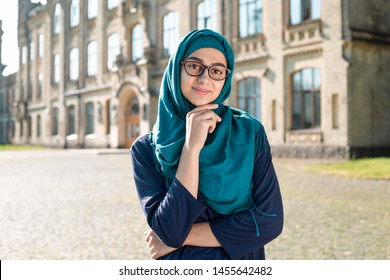 Smiling Muslim Young Business Woman In Hijab. Happy Arab Girl Student With Glasses. Beautiful Islamic Female.