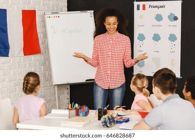 Smiling Native Speaker During French Lesson With Kids/Native Speaker During French Lesson/My Name Is ...