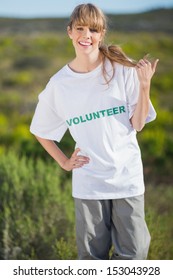 Smiling Natural Blonde Wearing A Volunteering T Shirt Looking At Camera