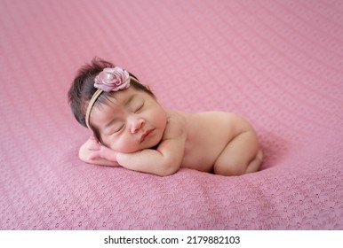 Smiling Newborn Baby With Mohawk Hair Sleeping