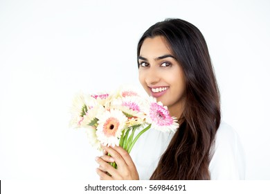 Smiling Nice Indian Lady Holding Bunch Of Flowers