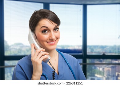 Smiling Nurse Talking On The Phone