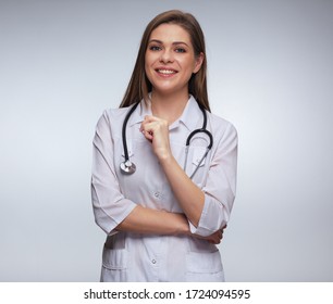 Smiling Nurse In White Uniform With Stethoscope Standing In Front Of Isolated White Studio Back.