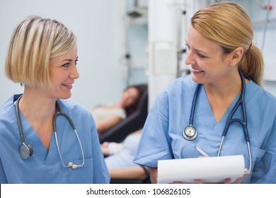 Smiling Nurses Talking In Hospital Ward, Healthcare Workers In The Coronavirus Covid19 Pandemic