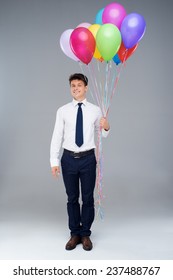 Smiling Office Manager Holding Baloons