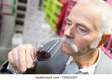 Smiling Old Man Drinking Wine