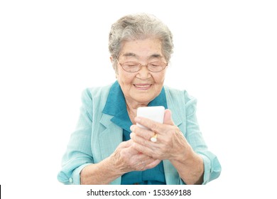 Smiling Old Woman With Mobile Phone