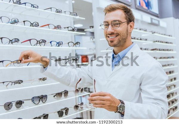 Smiling Optician White Coat Taking Eyesight Stock Photo 1192300213 ...