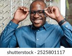 Smiling Optometrist with Blue Eyeglasses in Modern Optical Store Setting