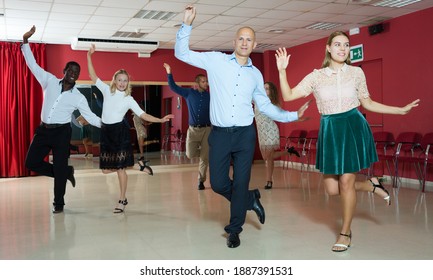 Smiling People Learning Tap Dance Movements In Dancing Class..