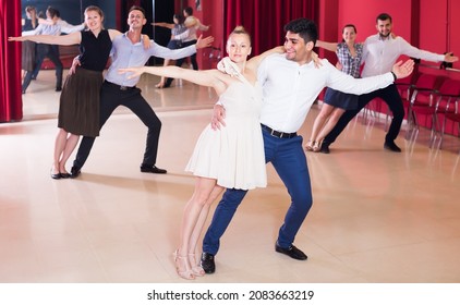 Smiling People Practicing Passionate Samba In Dance Class