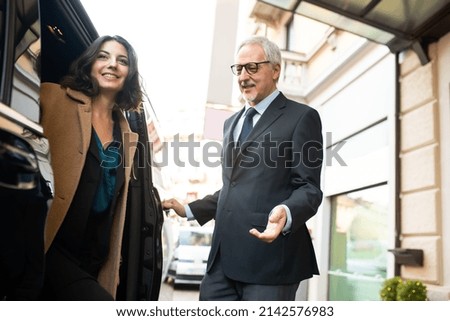 Smiling people using a shuttle transfer service
