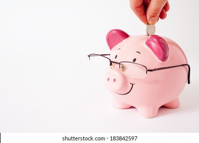 Smiling Pink Piggy Bank Wearing Glasses