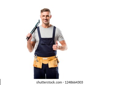 smiling plumber holding pipe wrench and showing thumb up sign isolated on white - Powered by Shutterstock