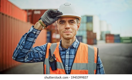 Smiling Portrait of a Handsome Caucasian Industrial Engineer in White Hard Hat, Orange High-Visibility Vest, Checkered Shirt and Work Gloves. Foreman or Supervisor Has a Two-Way Radio Attached. - Powered by Shutterstock