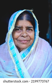 Smiling Portrait Of South Asian Aged Grandmother,close Up Headshot Of Bangladeshi Elderly Woman, Senior Widow In Traditional Costumes