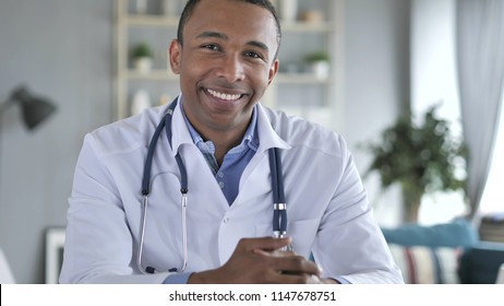 Smiling Positive African-American Doctor At Work Looking at Camera