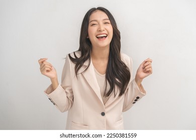 Smiling positive, attractive asian young woman, girl in beige suit formal dress, portrait elegant of pretty with long black hair, feeling happy looking at camera standing isolated on white background. - Powered by Shutterstock