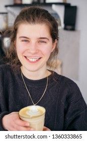 Smiling And Positive Girl With Latte Coffee Foam On The Lips