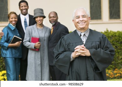 Smiling Preacher with Congregation