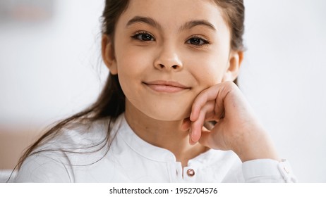 Smiling Preadolescent Girl Looking At Camera