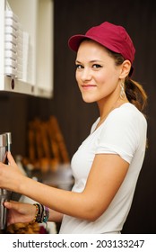 Smiling Pretty Saleswoman Portrait Inside Ice Cream Shop.