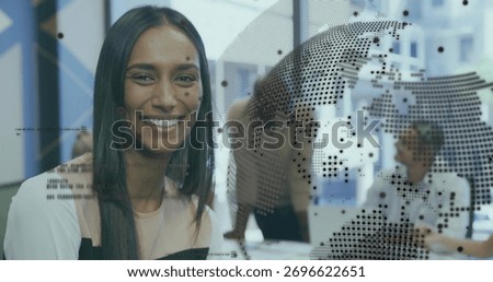 Smiling project manager collaborating with colleagues in modern office, with laptops globe overlay. Collaboration, teamwork, modernworkspace, dataanalysis, corporate, professional, innovation