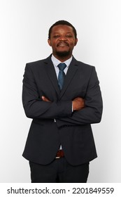 Smiling Proud African American Black Man In Business Suit With Crossed Arms On Chest Isolated On White Background. Happy Black Businessman, Chief Executive Officer Satisfied With Successful Good Deal