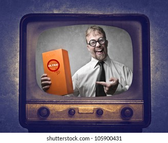 Smiling Salesman Advertising A Product At The Television