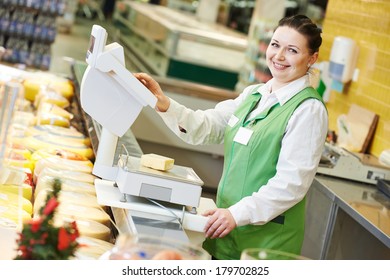 Smiling saleswoman assistant in supermarket working with scales balance to pregnant female customer during shopping at store - Powered by Shutterstock