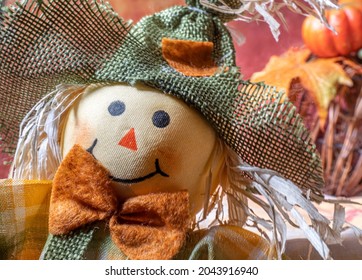 A Smiling Scarecrow Photobombs A Thanksgiving Spread.