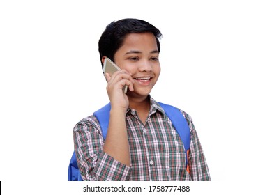 Smiling School Teen Boy Talking On Mobile Phone On White Background