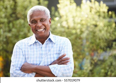 Smiling senior African American man with arms crossed - Powered by Shutterstock