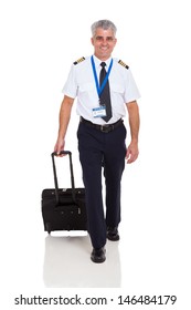 Smiling Senior Airline Pilot Walking With Briefcase On White Background