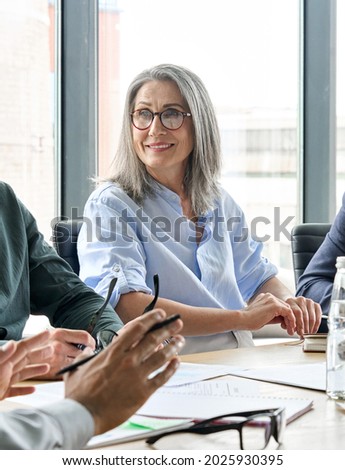 Similar – Foto Bild lächelnder männlicher Senior mit silbergrauen Haaren, Brille und Dreitagebart im Halbprofil schaut nach vorne