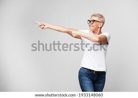 Similar – Image, Stock Photo Woman hand pointing with index finger over black